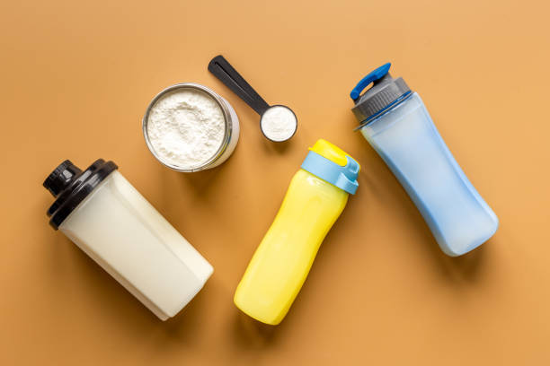 istock Whey protein powder and shaker with sport nutrition 1331057046