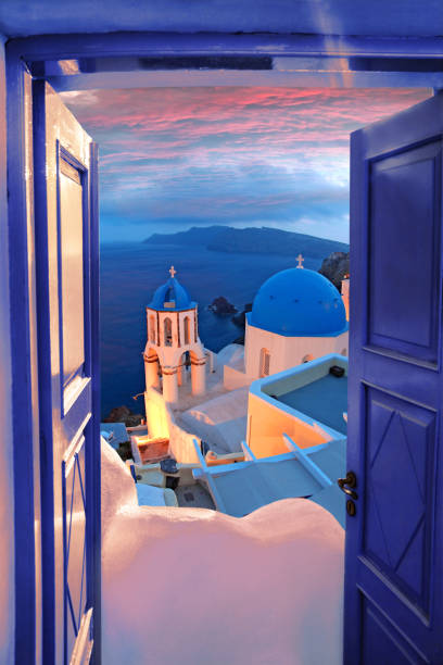 Santorini view with churches against old open blue door in Oia village, Greece Santorini view with churches against old open blue door in Oia village, Greece greek islands stock pictures, royalty-free photos & images