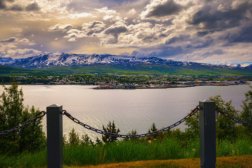 City of Akureyri with snowy mountains in the background and fjord Eyjafjordur in the foreground in northern Iceland.