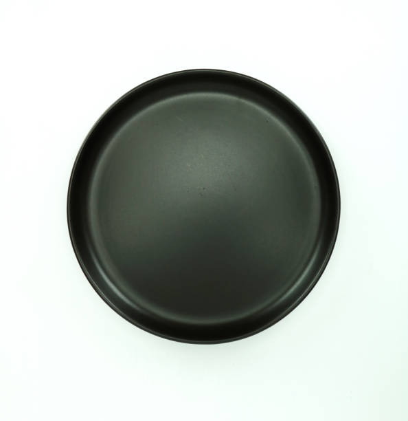 istock Black empty plate on whitr background, flat lay, food menu concept 1331059429