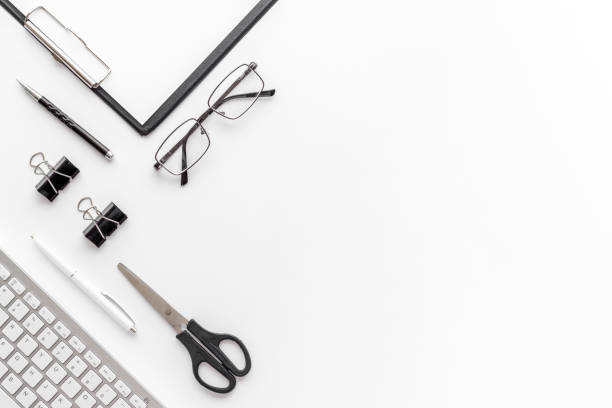 istock Trendy white office desk table with computer keyboard. Top view 1331059535