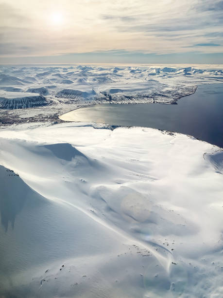 Svalbard snow, mountains and Arctic sea, aerial view