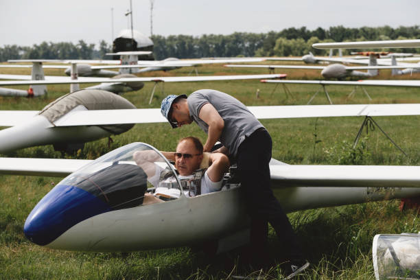 istock Pilots getting ready for the flight on glider airplane 1331059805