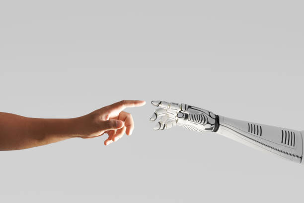 roboterhand berührung mit menschlicher hand - roboter stock-fotos und bilder