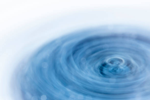 istock Abstract blurred background with rotating turbulent vortex. Crystal blue high-gloss shades with shimmering reflections. Winter template on the theme of cold and cooling technology 1331064787