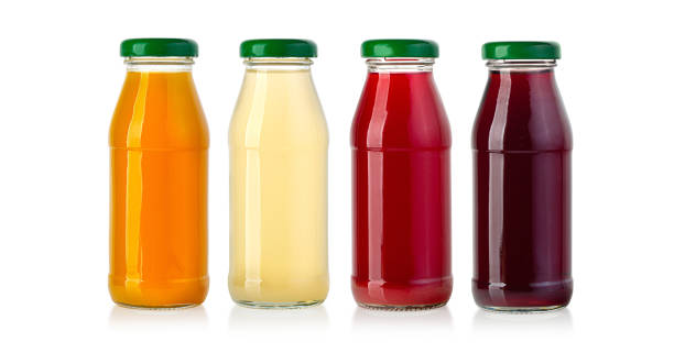 istock juice in glass bottle isolated on white 1331075597