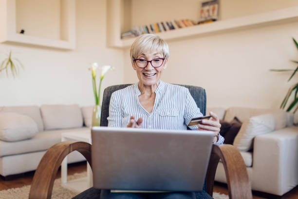 istock Senior woman ordering something online 1331077166