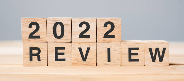 istock 2022 REVIEW cube block on table background. Resolution, plan, change, start and New Year holiday concepts 1331077182