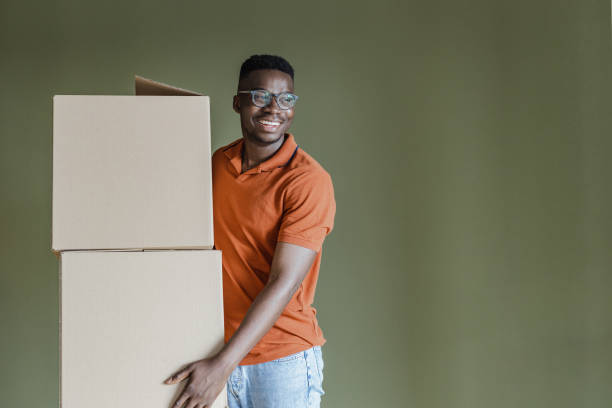 istock African-American man holding carboard boxes 1331078186