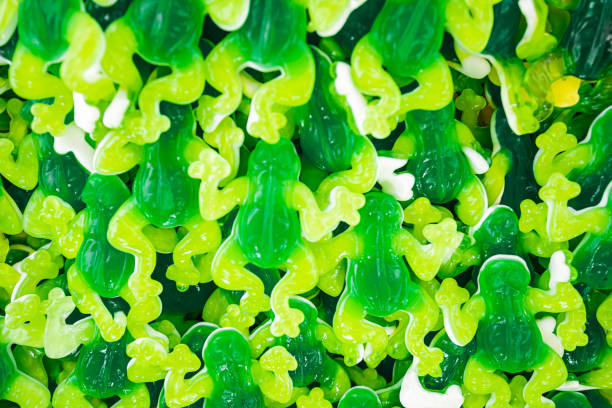 green and white gummy candy frog. marmalade, toffee