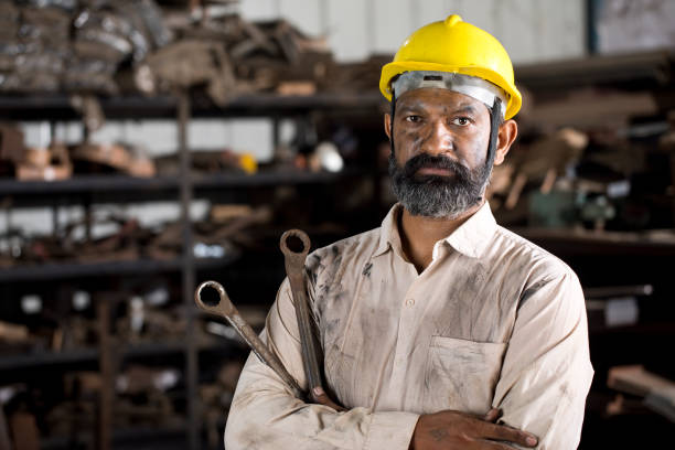 istock Industrial worker holding wrench 1331084988