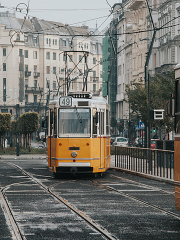 Orange and white tram in the city of Budapest, Hungary. Travel concept.