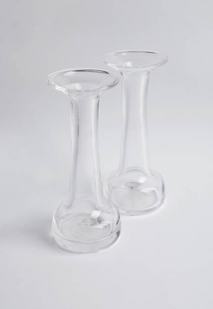 istock Two stylish glass vases on light background 1331089416