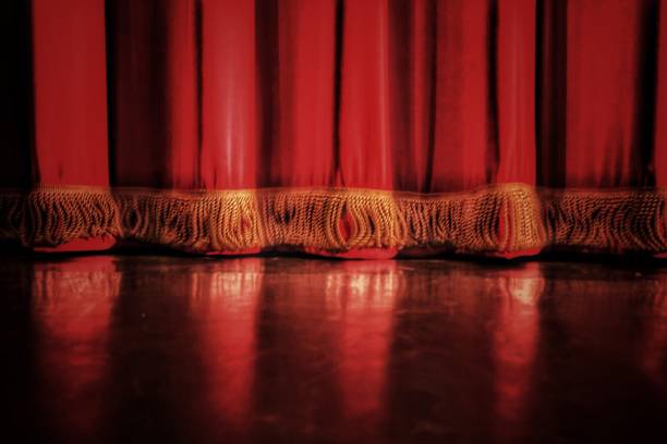 Stage curtain closeup Closeup of the bottom of a stage curtain stage curtain up stock pictures, royalty-free photos & images