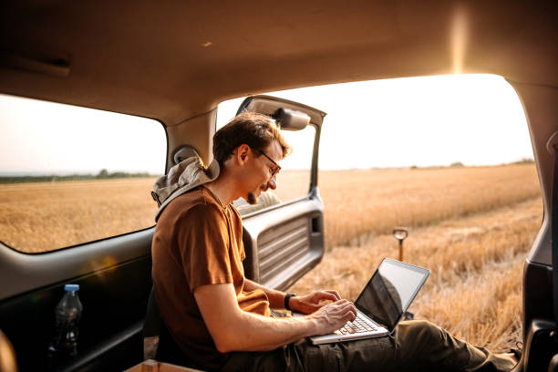 Technology is key part in every business Young farmer collecting data of his field on laptop meteorology equipment stock pictures, royalty-free photos & images