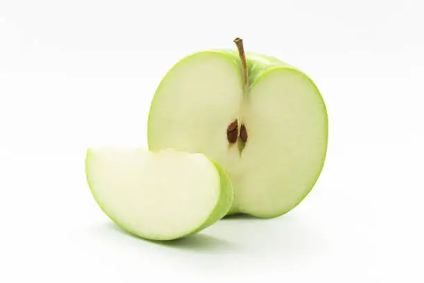 half green apple on white background in Valencia, Valencian Community, Spain