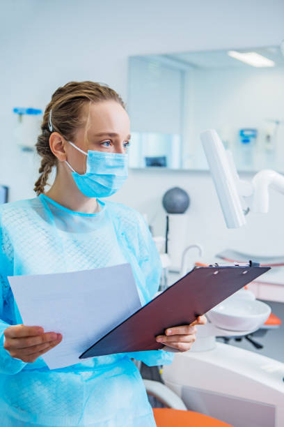 istock A female dental assistant preparing for work in a dental surgery 1331092375