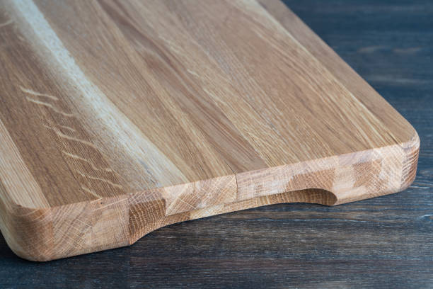 istock Wooden cutting board on wooden table background 1331093095