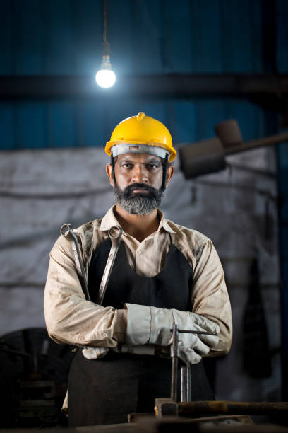 istock Industrial worker holding wrench 1331097316