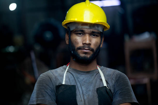 istock Industrial worker in protective workwear at factory 1331098480