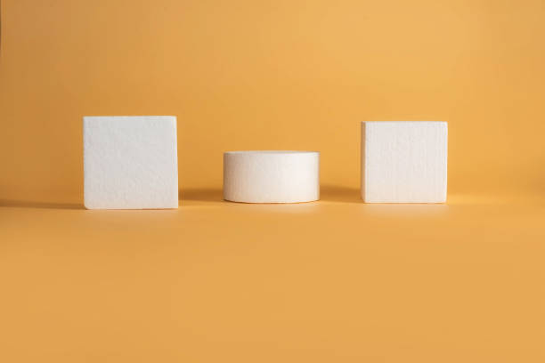 istock Empty white coasters podium on yellow background. Blank unbranded shopfront. Product advertisement. Copy space. Scene with Minimal geometrical forms Fashion, beauty, care, trend concept. 1331098647