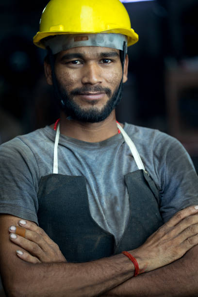 istock Industrial worker in protective workwear at factory 1331098648