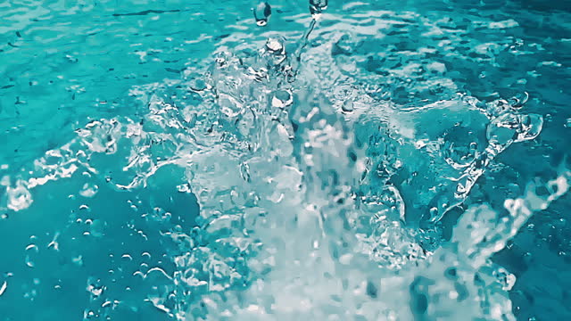 Turquoise cartoon water stream directly above at slow motion