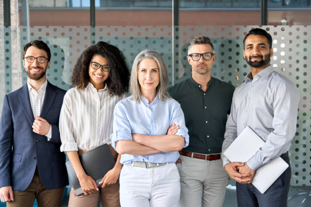 istock Happy diverse business people team standing in office, group portrait. 1331101146