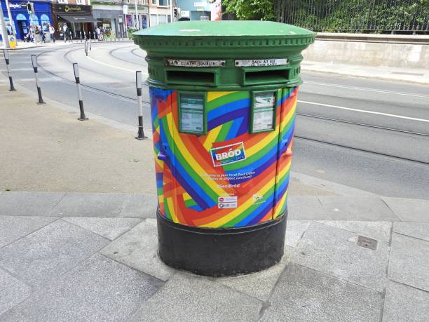Pride post box 11th June 2021 Dublin, Ireland. A green post box on Nassau Street, Dublin city centre, decorated in the LGBTQ pride rainbow colours to celebrate Pride Month. nassau street stock pictures, royalty-free photos & images