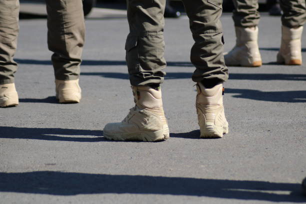 istock Military shoes lined up neatly 1331107111