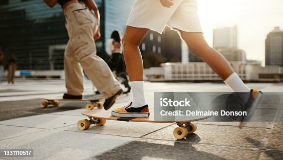 istock Cropped shot of two unrecognizable women using skateboards in the city during the day 1331110517