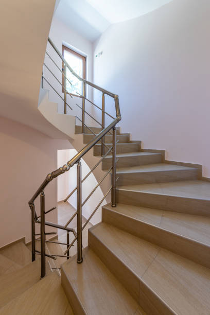 istock Modern stair case between floors. Stairs with metallic rail  in modern building 1331111880