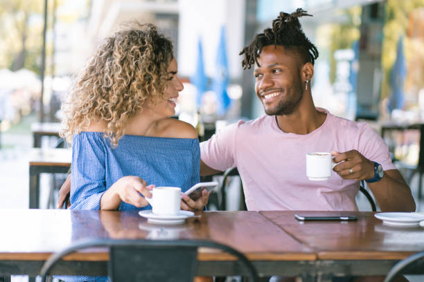 istock Young couple drinking coffee at a coffee shop. 1331113093