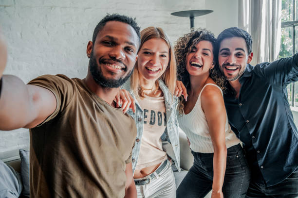 istock Group of friends taking selfies together. 1331113427