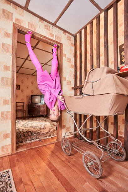 istock Woman looking away while walking through the hall with baby carriage 1331114206