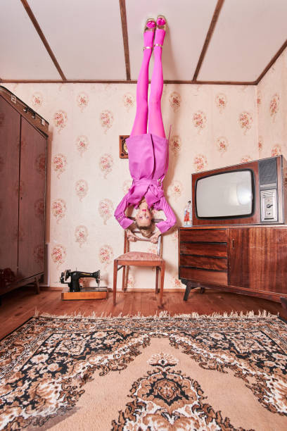 istock Model wearing pink look looking at the camera while leaning at the chair 1331114236