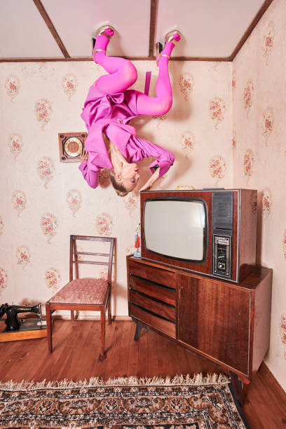 istock Woman standing at the creative pose at the ceiling while posing at the vintage interior 1331114276