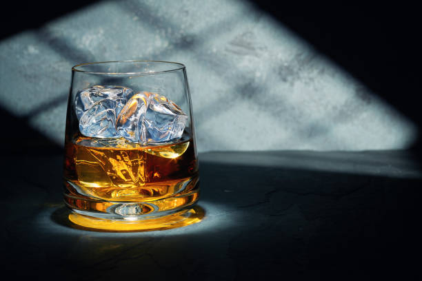 at the end of a hard day - whisky glass alcohol drink imagens e fotografias de stock