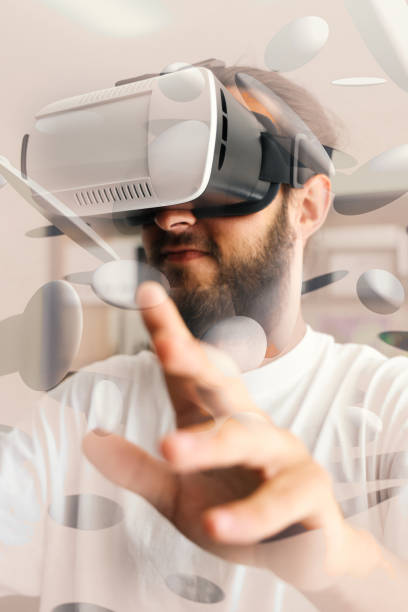 istock Man Wearing virtual reality glasses in Office 1331121606