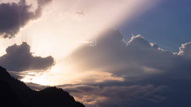 istock spectacular sunbeams through the splendor of clouds in an austrian mountain setting 1331123964