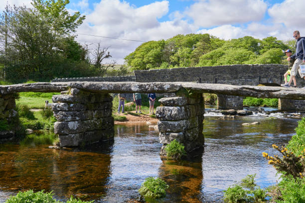 istock Medieval clapper bridge over the East Dart River at Postbridge on Dartmoor in Devon, West Country, England, UK 1331124906