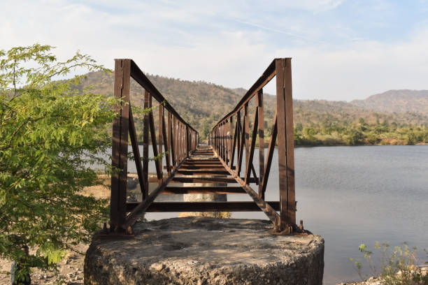 istock An old rustic and dark steel river bridge across a river 1331127106