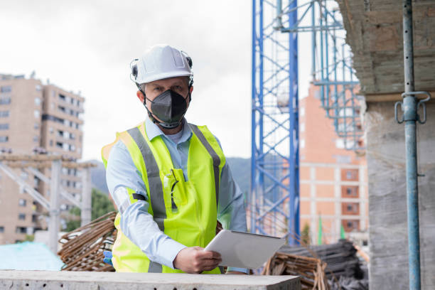 istock 50-year-old engineer man is in the middle of work that leads reviewing documents from his electronic tablet 1331128209