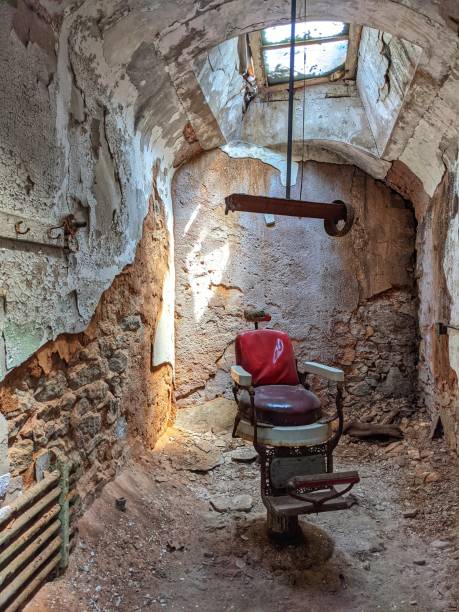 istock Barber chair in abandoned cell 1331132446