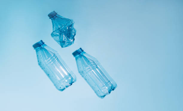 istock Used empty crumpled plastic bottles on blue background. Recycling recycled plastic. Pollution, environmental protection. 1331132617