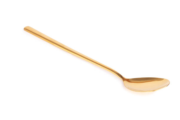 istock spoon brass gold isolated on white background 1331134412