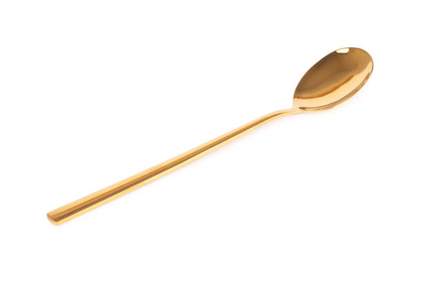 istock spoon brass gold isolated on white background 1331134416