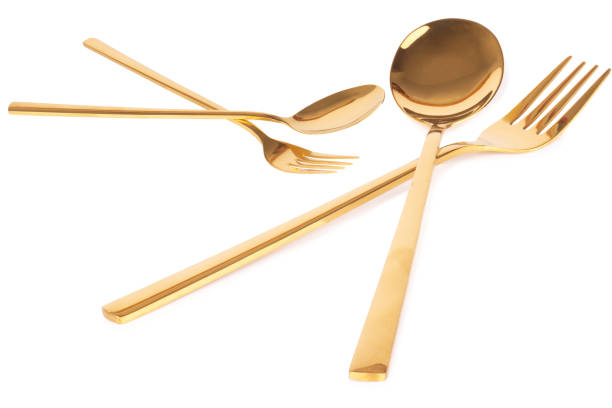 istock spoon fork brass gold isolated on white background 1331134417