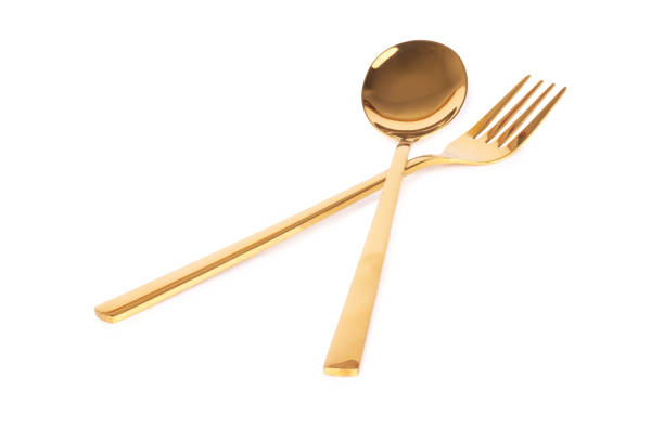 istock spoon fork brass gold isolated on white background 1331134418