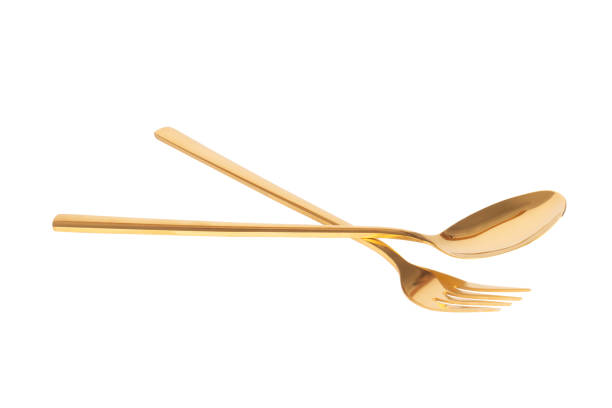 istock spoon fork brass gold isolated on white background 1331134420